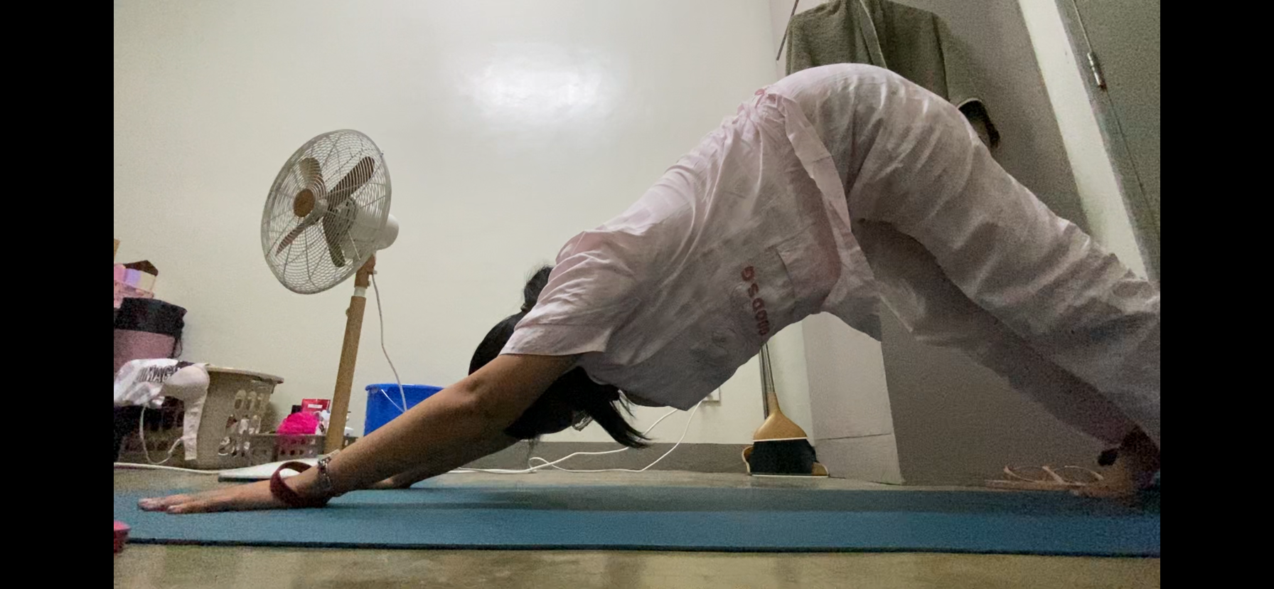 Angel doing mobility pose 3 on Day 1